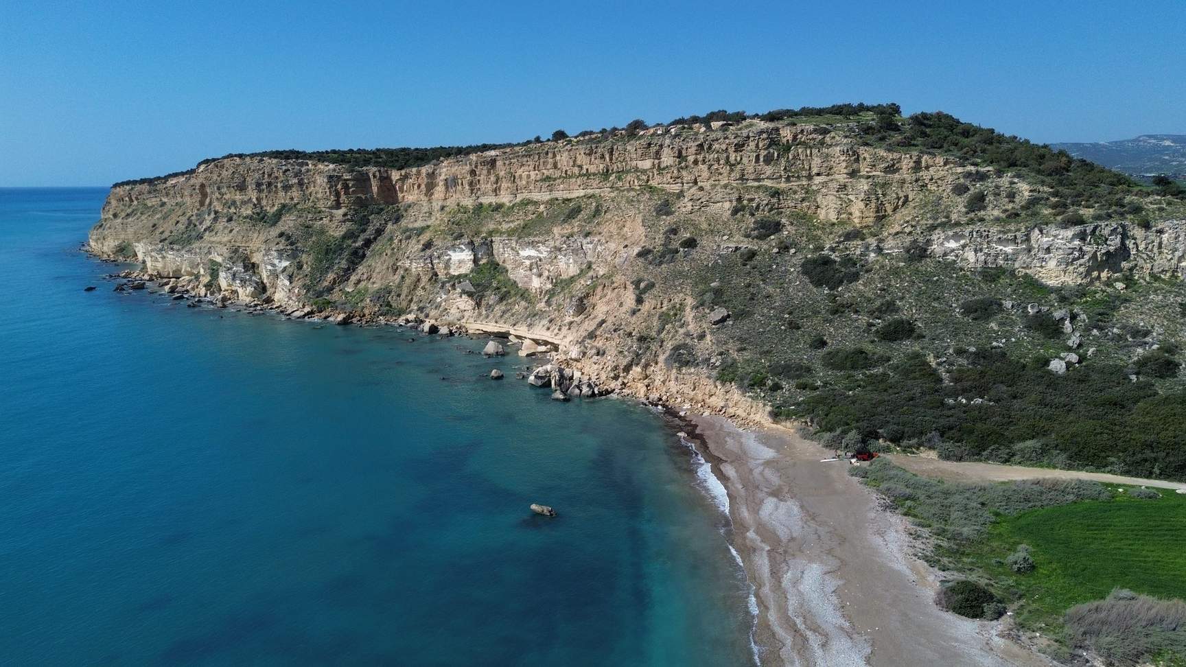 Aerial view of the Cyprus coast with clear turquoise water